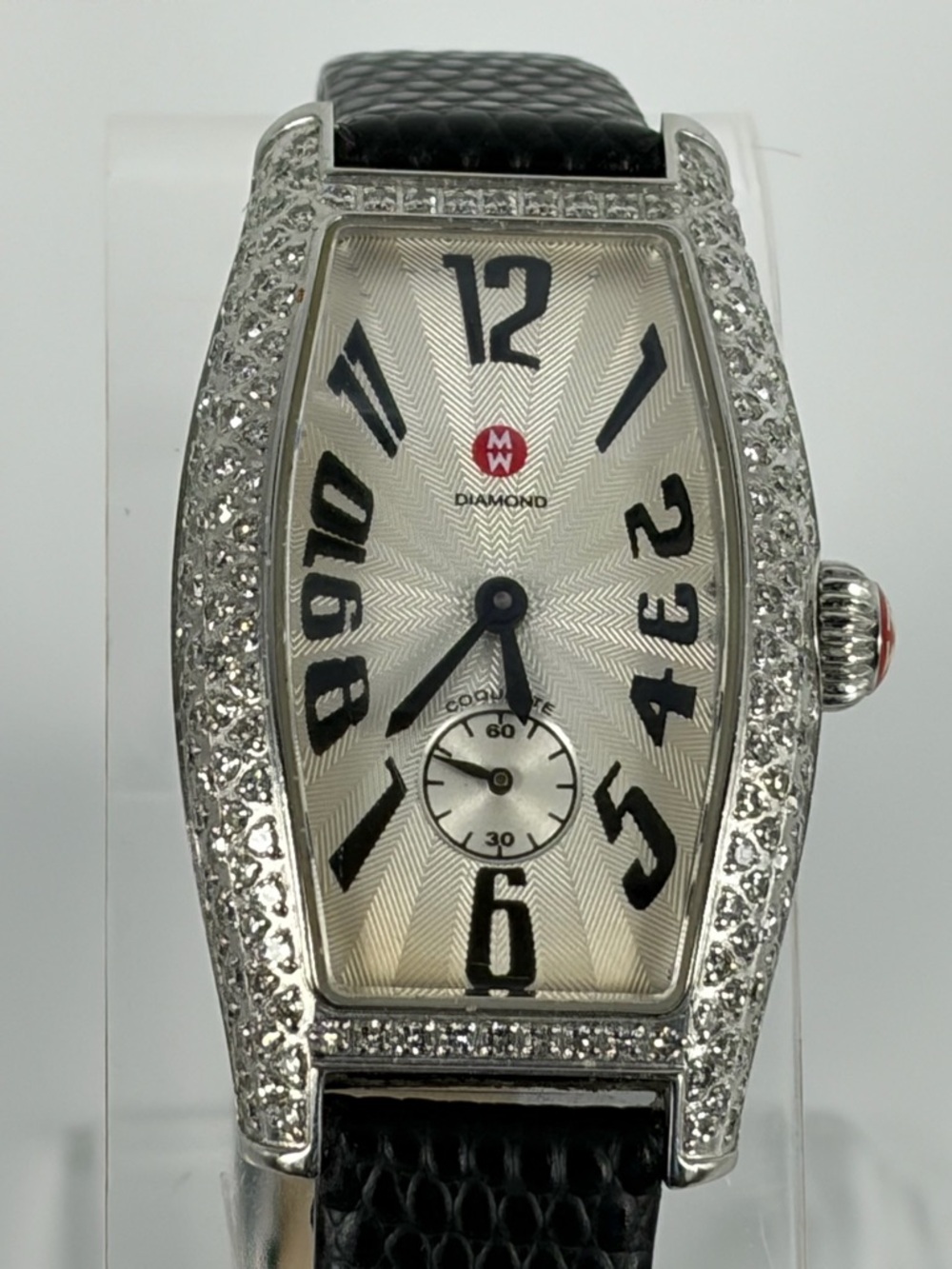Genuine Michele Coquette ladies’ tonneau watch with diamond bezel and lugs.